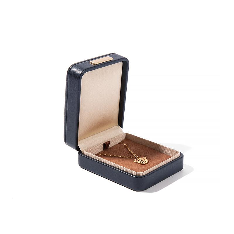 Högkvalitativ PU-läder Rundade Hörn Gyllene Spänne Smyckeskrin Ring Hänge Halsband Armband Förpackning Display Förvaringslåda
