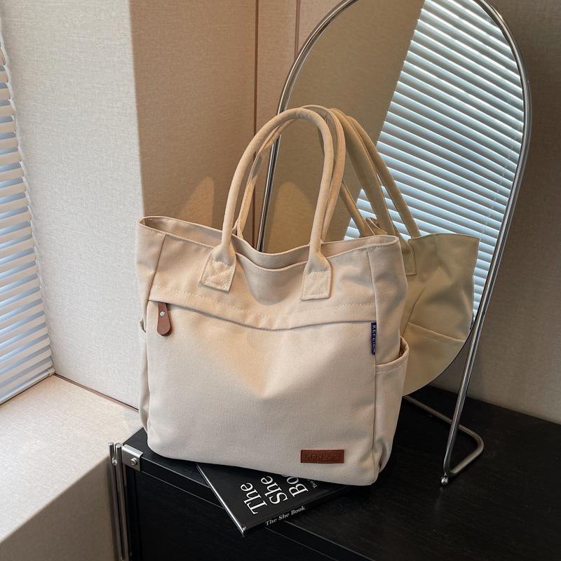 Casual large-capacity canvas bag women's new fashion commuter versatile shoulder bag college student tote bag