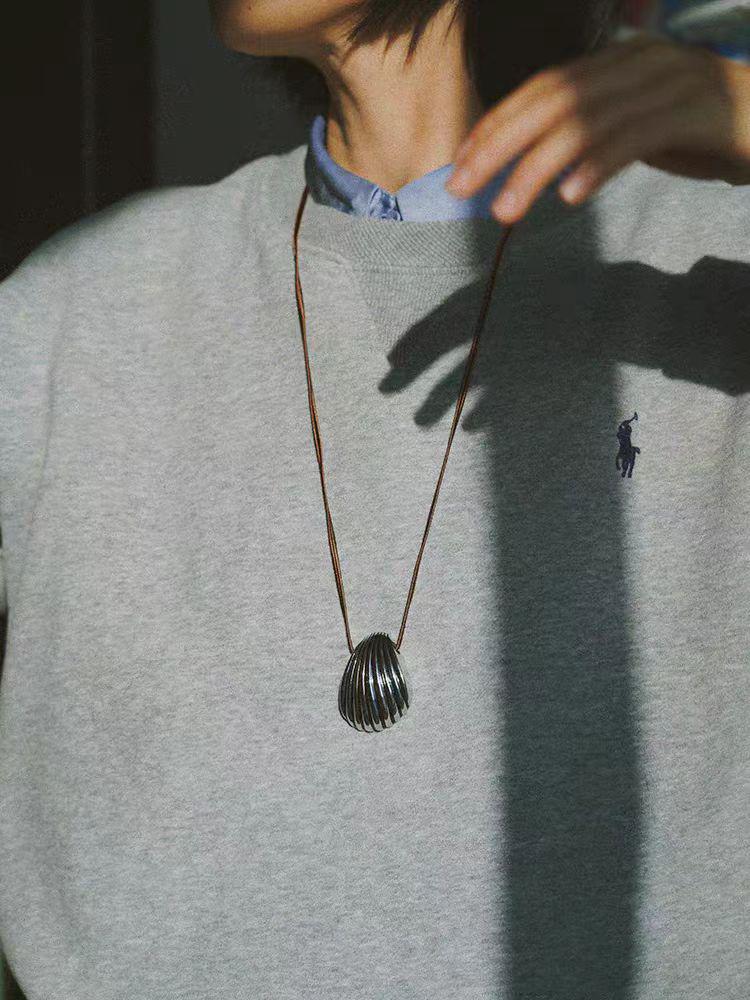 Elegant Silver Seashell Pendant Necklace with Brown Leather Cord