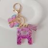 Purple Iridescent Resin Letter Keychain with Butterfly Tassel