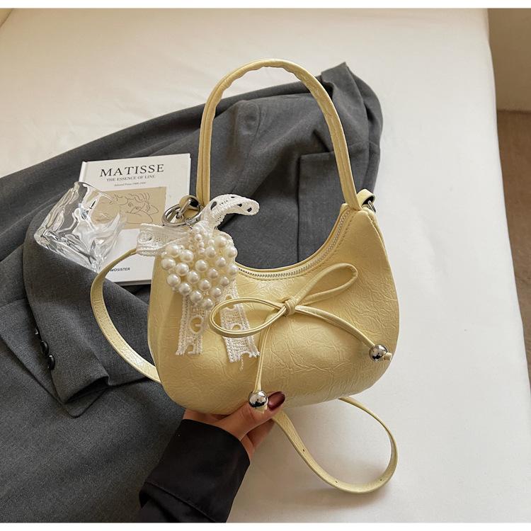 Niche Bow Hand Carry Crescent Moon Bag Women's 2025 New Fashion Simple Shoulder Armpit Bag Shoulder Messenger Bag