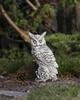 Garden sculpture of concrete owl figurine