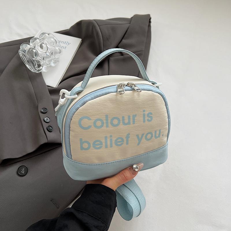 

Simple casual portable small bag women s 2025 new letter printing contrasting color small square bag fashionable shoulder messenger bag синий
