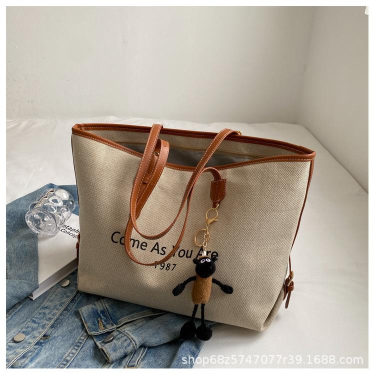 

This year s popular bag women s large capacity 2025 new versatile canvas shoulder shopping bag class commuter tote bag