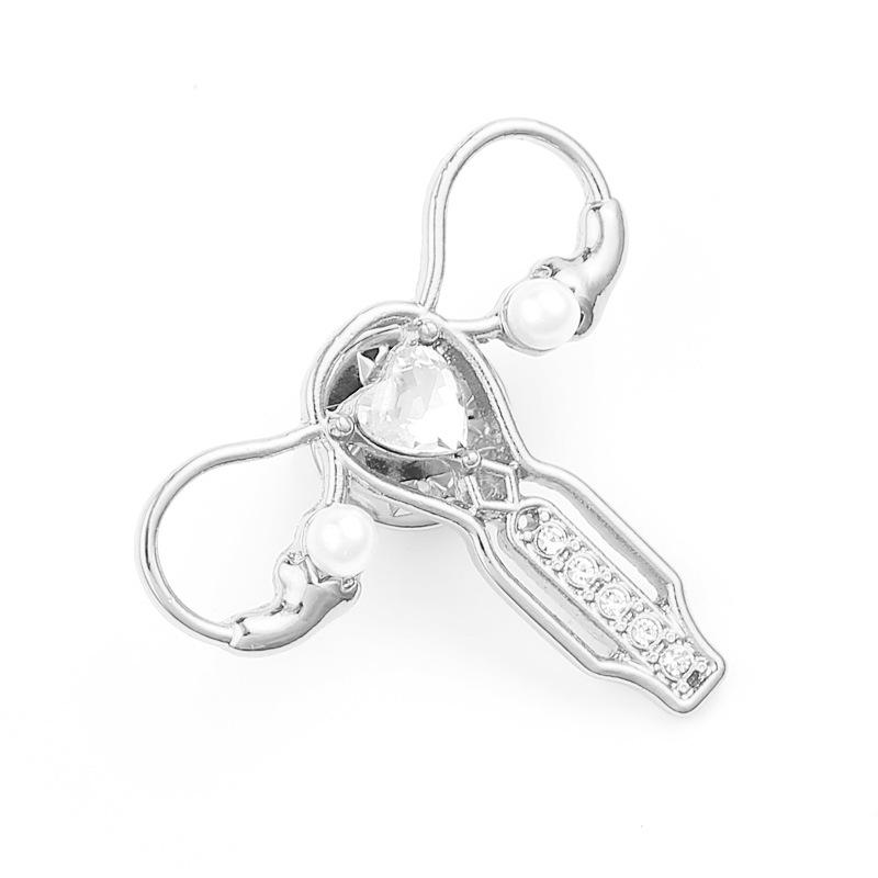 

Брошь в форме матки: Стильный аксессуар для корсажа серебряный