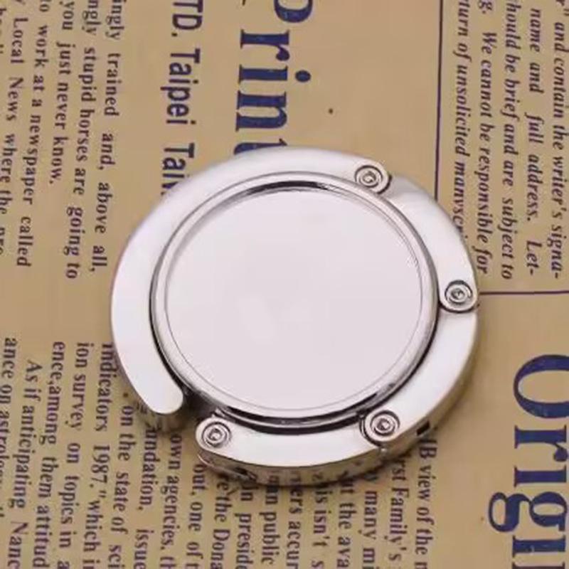 

Портативный складной крючок для сумки - Креативный круглый металлический сувенир