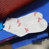Chaussettes blanches simples, polyvalentes, jolies, nœuds papillon, petites fleurs, chaussettes tube moyennes pour femmes, Kawaii Harajuku Jk Lolita, chaussettes en coton pour filles