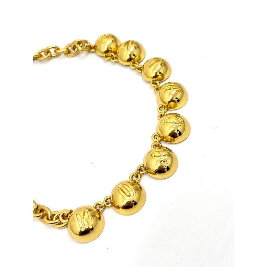 Used Moschino gold color necklace with logo charm vintage