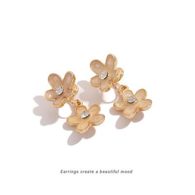 Off-White Floral Stud Earrings: Elegant, Versatile, and Delicate Mosquito Coil-Shaped Clips for Women.