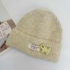 Three-dimensional puppy patch knitted hat female, soft waxy vertical pattern curled edge cold hat, autumn and winter warm wool hat