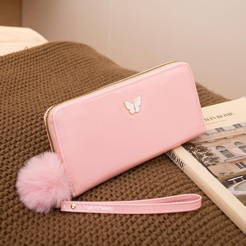 New solid color butterfly label wallet women's long zipper clutch bag hairball simple change bag one piece hair