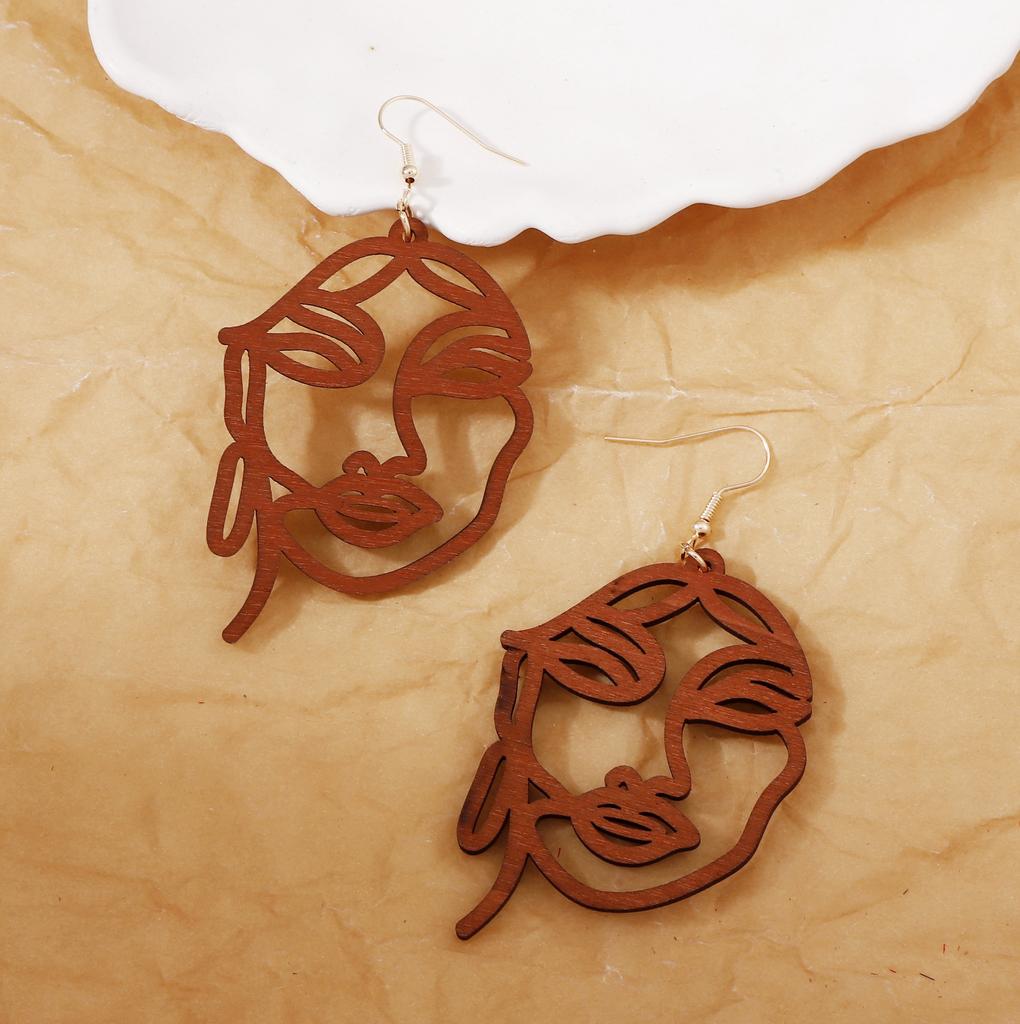 Niche design sense, personalized earrings, fashionable and trendy laser-cut wooden abstract face ear hooks