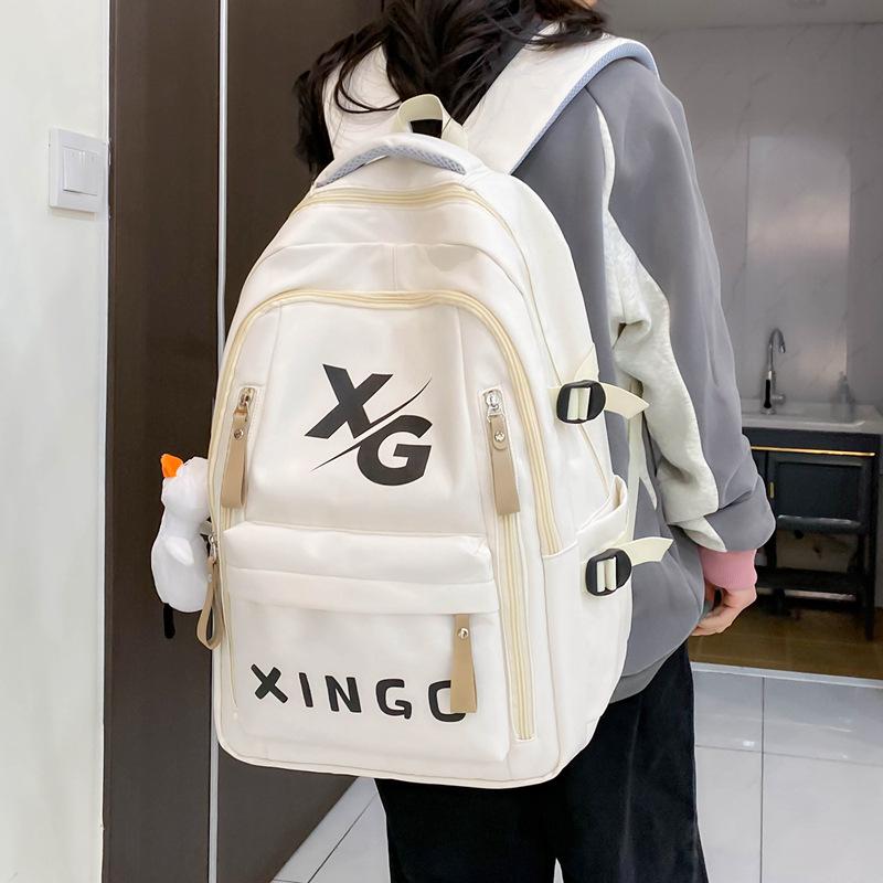 Schoolbag1011 new large-capacity backpack to reduce the burden of small, medium and early college students schoolbags, street trend travel bags,