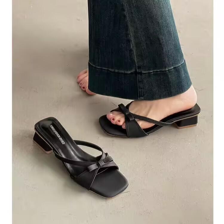 Elegant fashion square head thin heel cool slippers women's 2025 spring and summer word with bow temperament versatile cool half drag tide