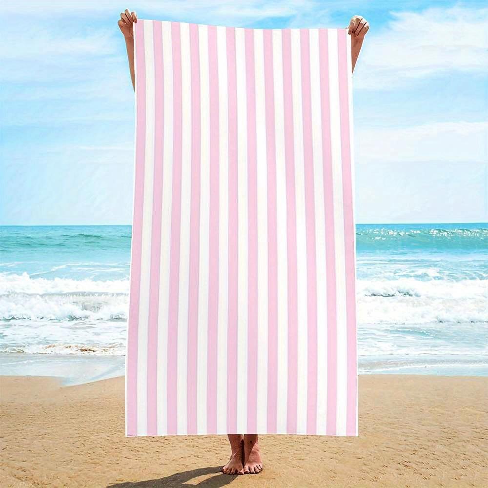 Stylish pink and white striped beach towel, made of polyester, machine washable, suitable for travel, pool, and beach decoration