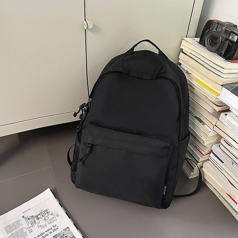 New trendy and cool men's casual backpack, junior high school student class schoolbag, women's large-capacity simple backpack