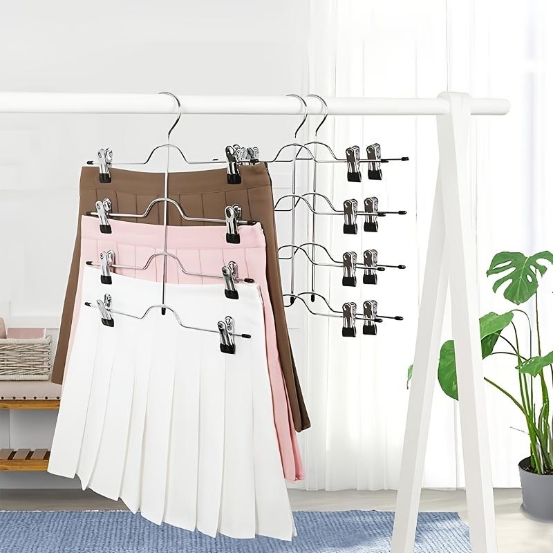 Four-layer dress hanger with 8 clips. Adjustable non-slip hanger. Made of stainless steel. Foldable for drying clothes.