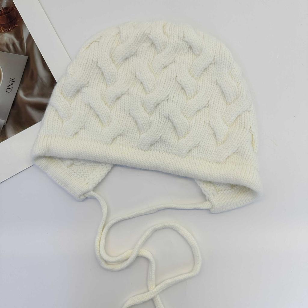 Retro twist pattern ear protection knitted hat women's autumn and winter lace-up bow wool hat warm cover cold hat