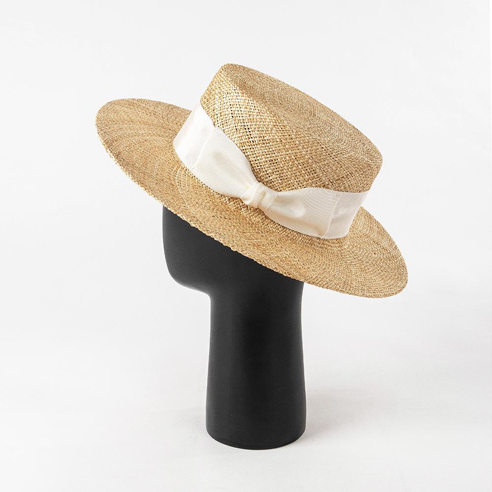 Spring and summer new fashion two-color webbing bow treasure grass wide brim flat top hat outdoor shopping sun protection straw hat
