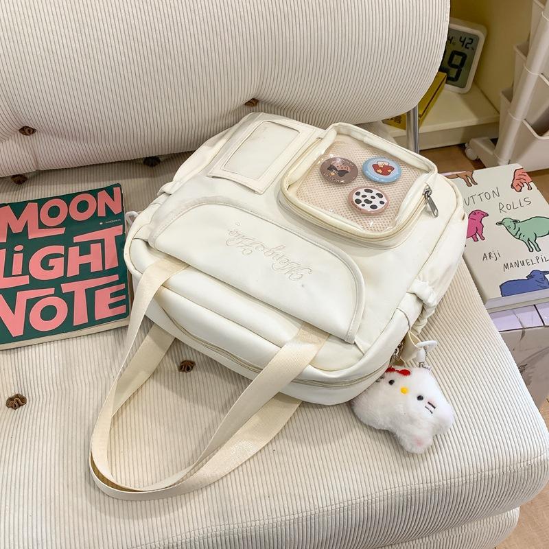 Japanische Schmerzbeutel Umhängetasche Damen Neue modische große Kapazität tragbare Tragetasche vielseitige Studenten-Schultertasche Trend