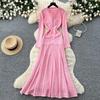 Pink knitted dress women's long-sleeved A-shaped skirt high waist and thin commuter temperament skirt small fragrant style long skirt