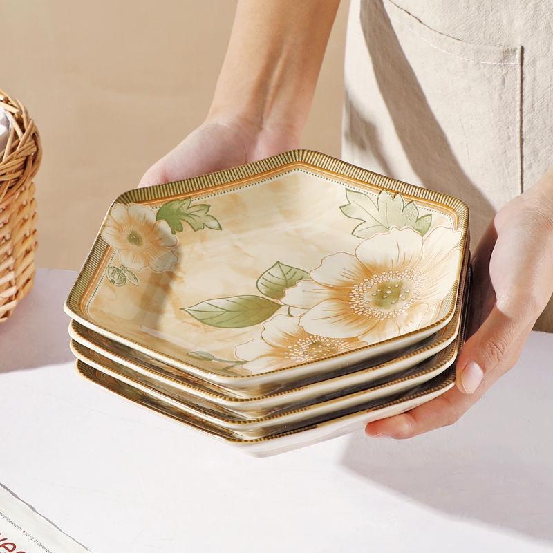 Kamelie Sechseckiges Teller- und Schüsselset: Elegantes rautenförmiges Design
