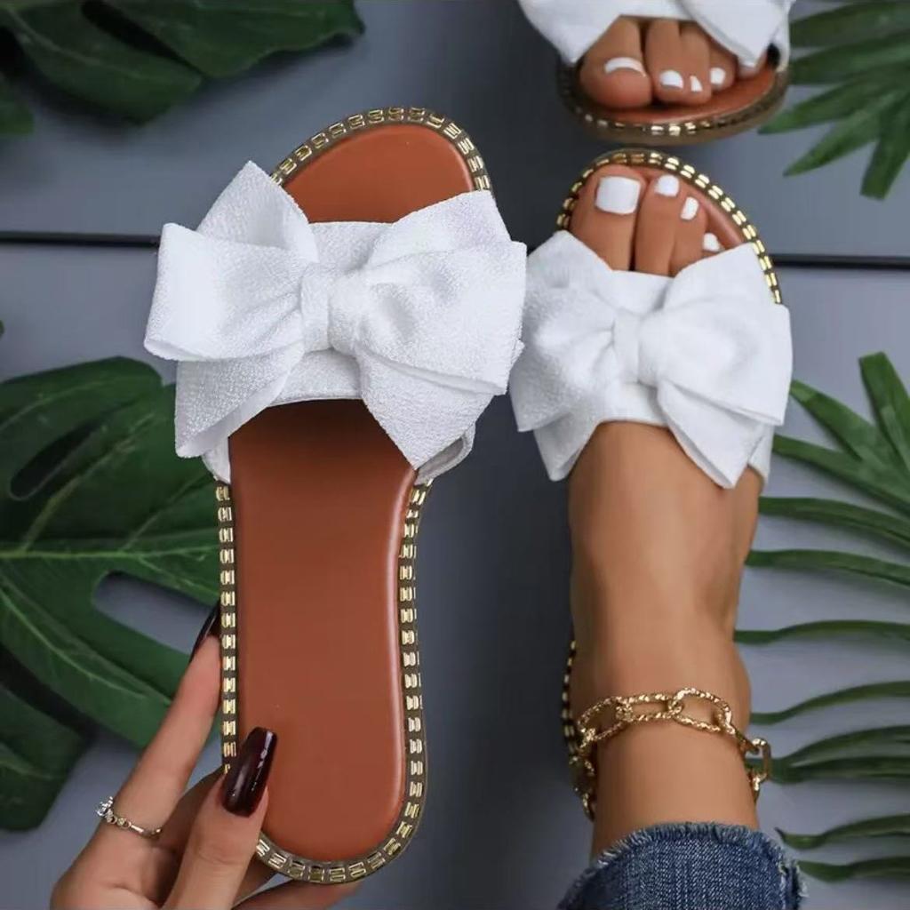 New flat-bottomed rhinestone bow one-word slippers for women to wear solid color light cloth cool slippers 2025