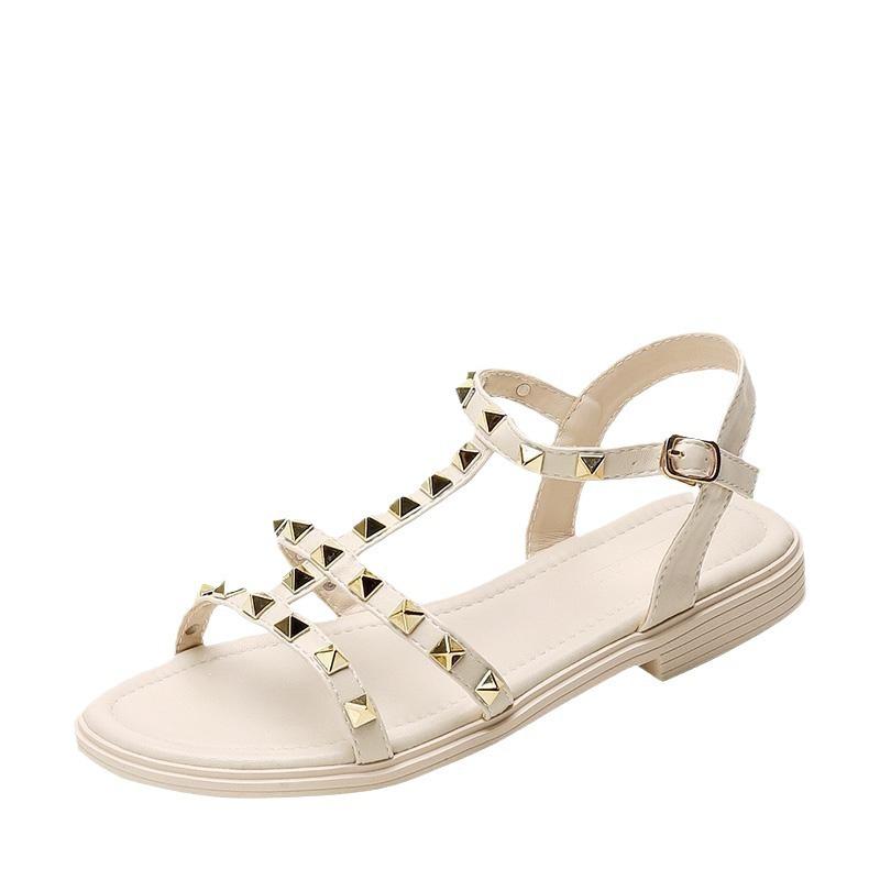 2025 summer new versatile flat-bottomed fairy style with skirt rivets Roman fashion Internet celebrity sandals women