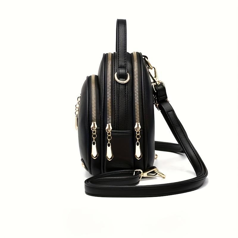 Rucsac mic PU pentru naveta zilnică a femeilor. Design simplu si elegant. Folosește o culoare solidă cu fermoare multiple. Poate fi purtat în mână.