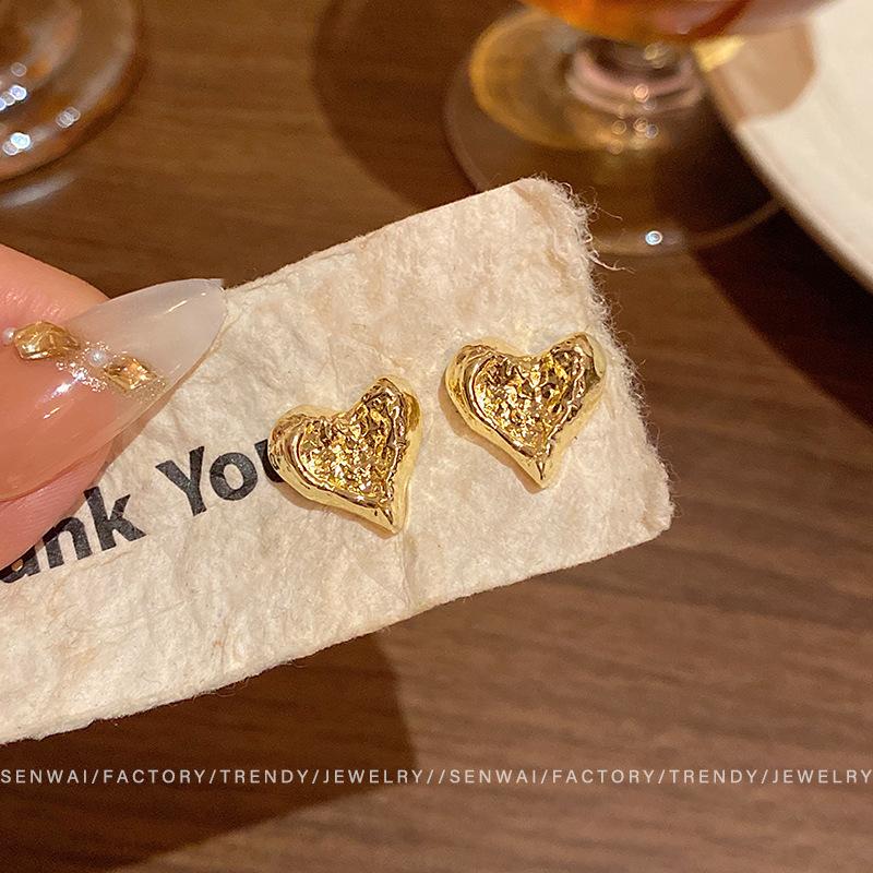 Advanced pleated irregular love stud earrings women s explosion cold wind temperament earrings new ear jewelry