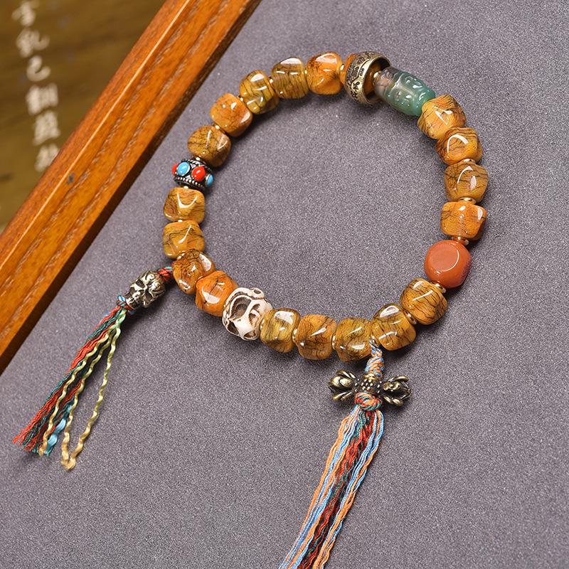 Buddhistisches Gebetsperlenarmband aus tibetischem Yakknochen und Passionsfruchtsamen