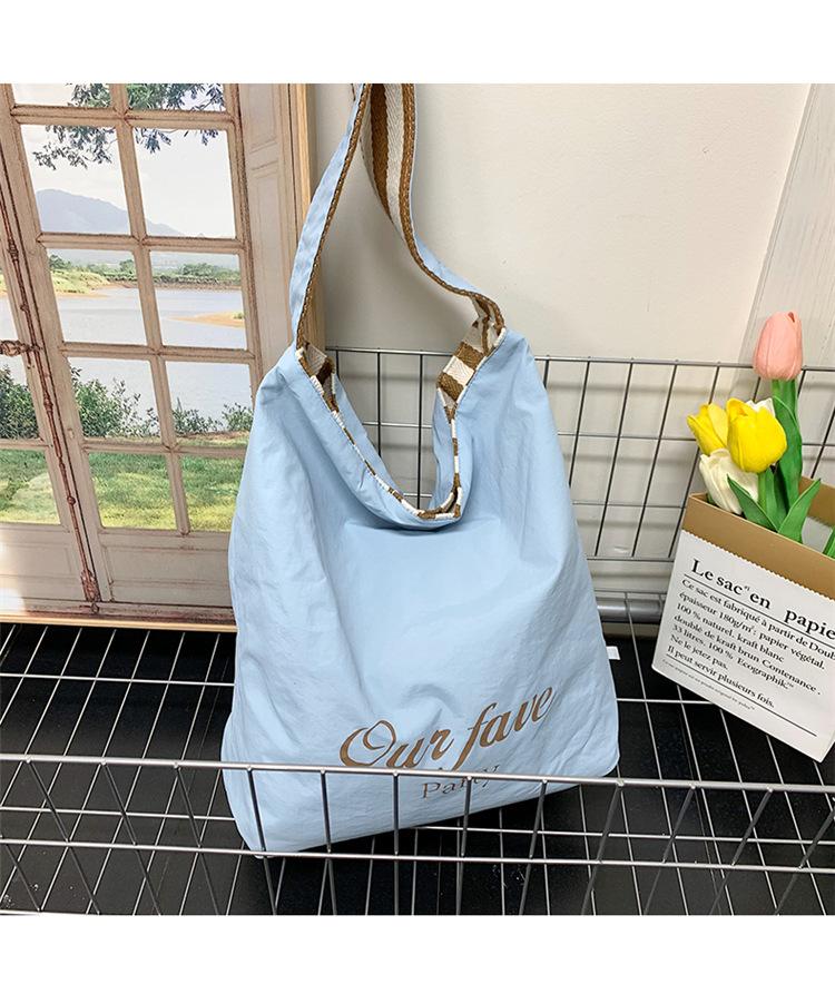 

Fashion striped canvas bag New large-capacity tote bag Simple letter casual commuter shoulder bag синій