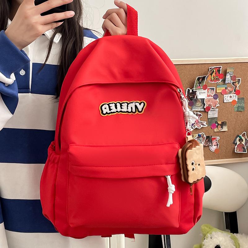 

Large Canvas Backpack: Versatile Travel Bag & Student Bookbag for Men and Women Without Pendant вина червоного кольору