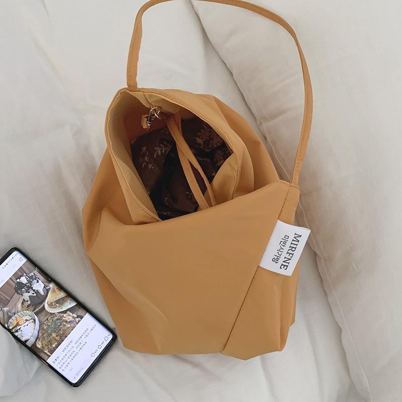 Casual large-capacity bag women's 2025 simple canvas bag versatile one-shoulder armpit bag student class bag handheld