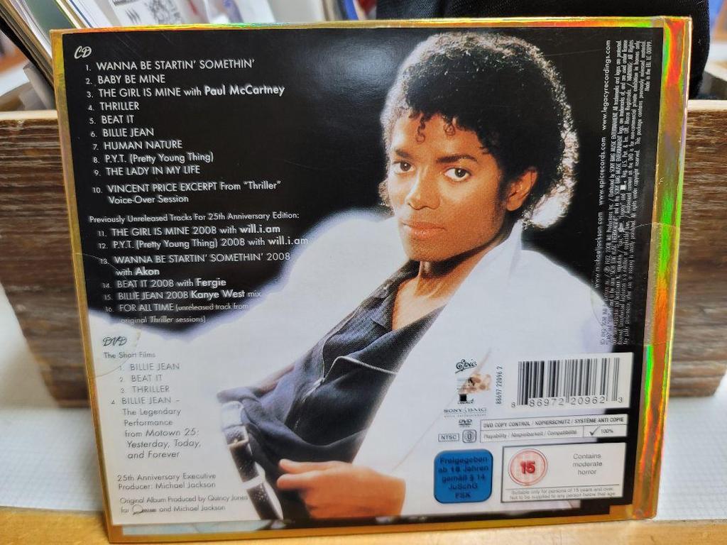 [USED] Thriller 25th Anniversary Edition, OFF THE WALL, and 3 Moonwalker DVDs.