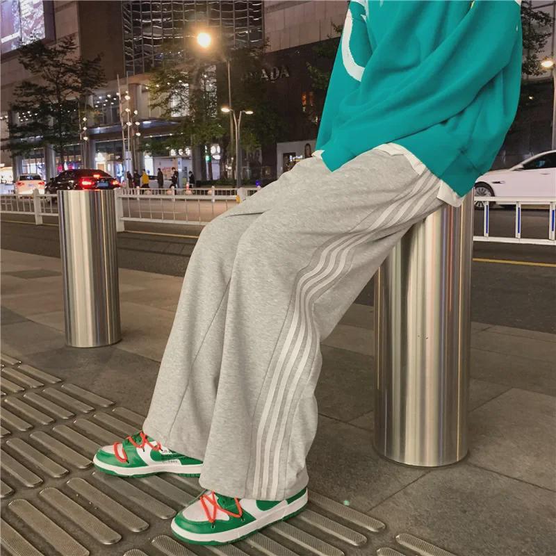 Damskie spodnie sportowe w paski w stylu koreańskim - luźne, sięgające do ziemi, w jednolitym kolorze, na wiosnę i jesień