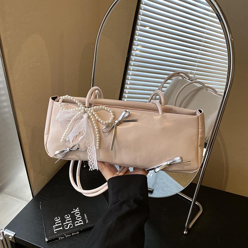 

High-end texture niche bag women s 2025 new commuting versatile one-shoulder armpit bag outing handbag baguette bag single bag розовый