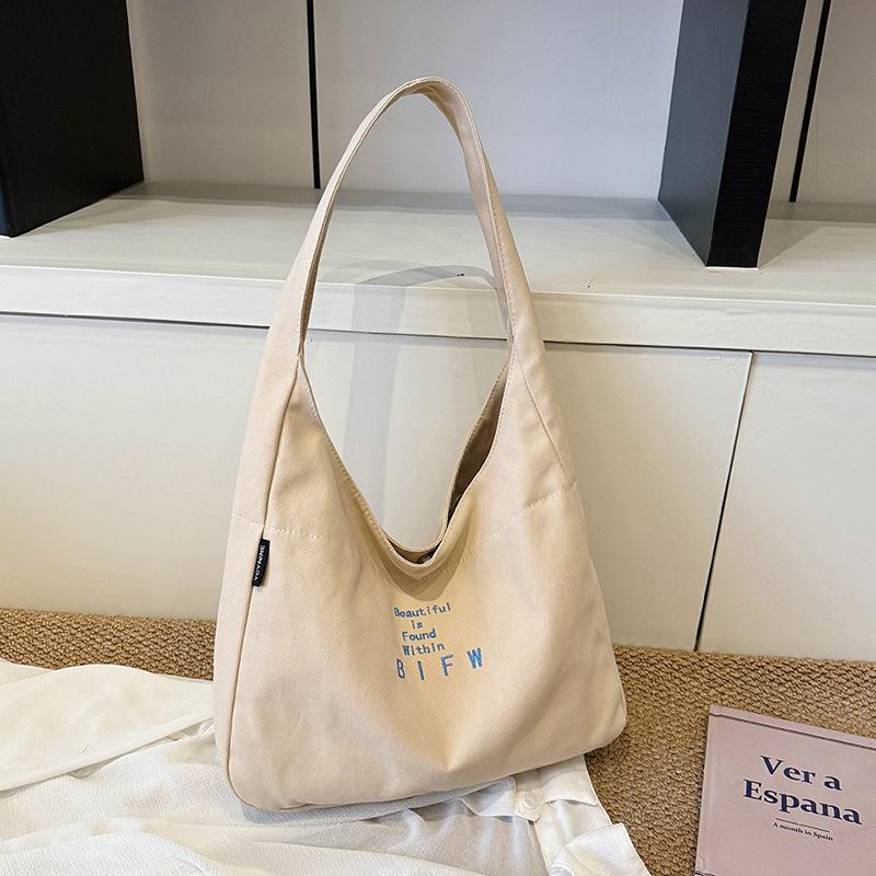 Large capacity bag women's autumn leisure 2025 new simple shoulder canvas bag fashion sense niche commuter tote bag