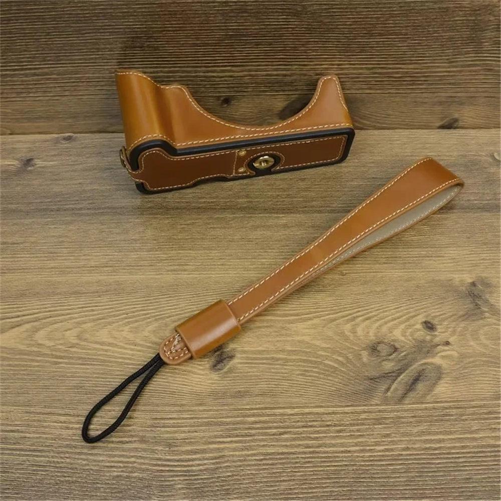 

PU Leather Camera Half Body Case For Canon EOS R50 R100 Bottom Cover With Hand Strap Battery Opening