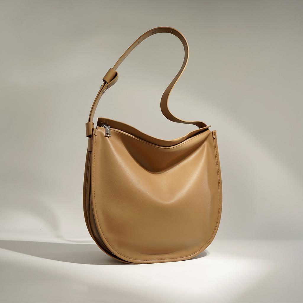 Sac cabas en cuir simple et à la mode Cuir de vachette souple Grande capacité Commuting Polyvalent Simple épaule Bandoulière Sac seau Femmes