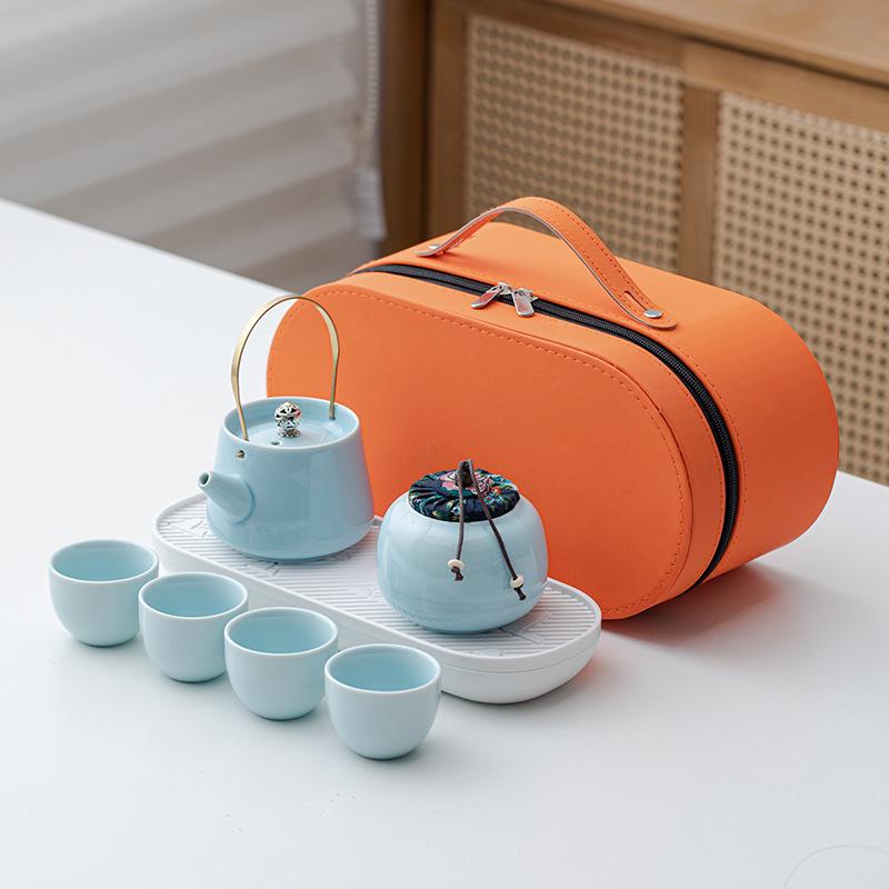 Portable Ceramic Kung Fu Tea Set: Teapot with Handle and Four Cups for Travel and Business Gifting