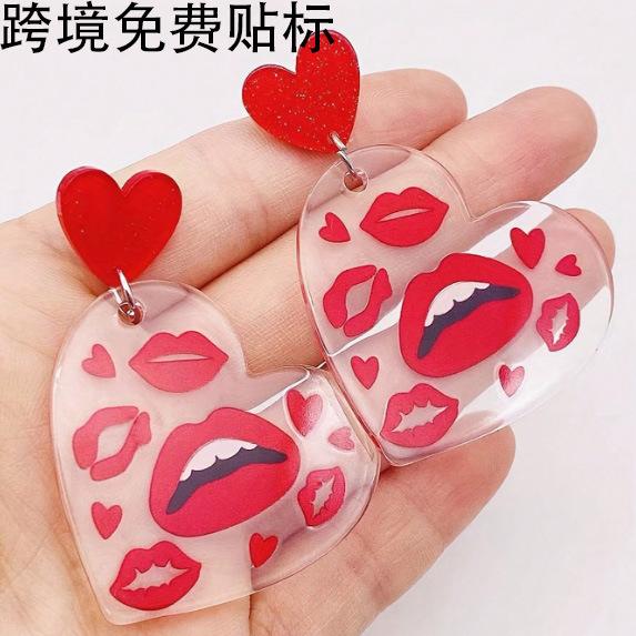 A pair of Valentine's Day acrylic red heart-shaped earrings, sweet personality red lips, niche trend women's earrings.