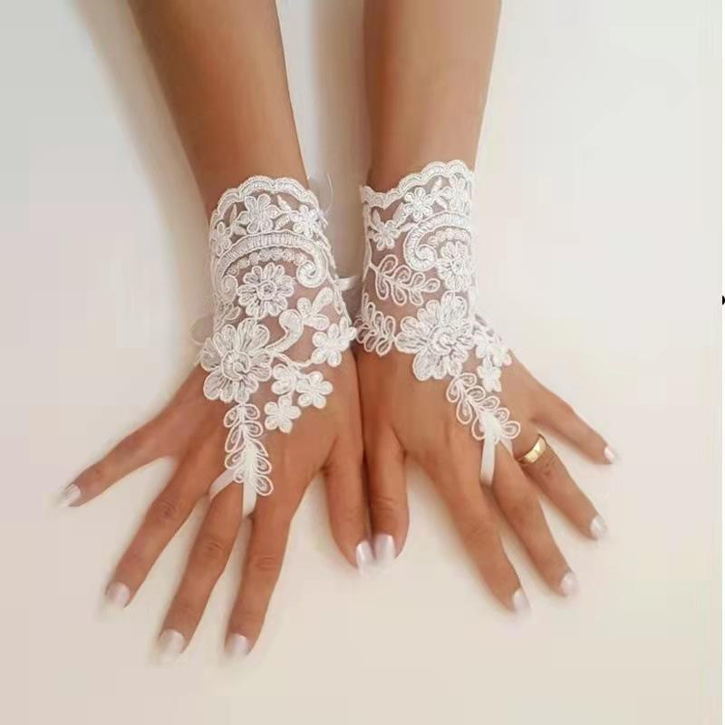 Gants de mariée extensibles Élégants gants de mariée blancs en dentelle sans doigts Design floral décoratif avec nœud, Parfaits pour les robes de mariée