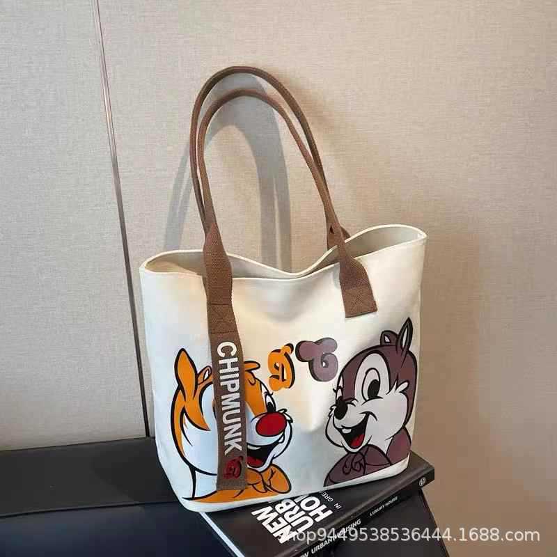

Cartoon large-capacity canvas bag women s new portable shopping bag shoulder bag go out bento bag portable tote bag