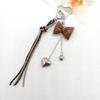 New Leather Heart Pendant Bag Keychain with Braided Rope and Bow Design