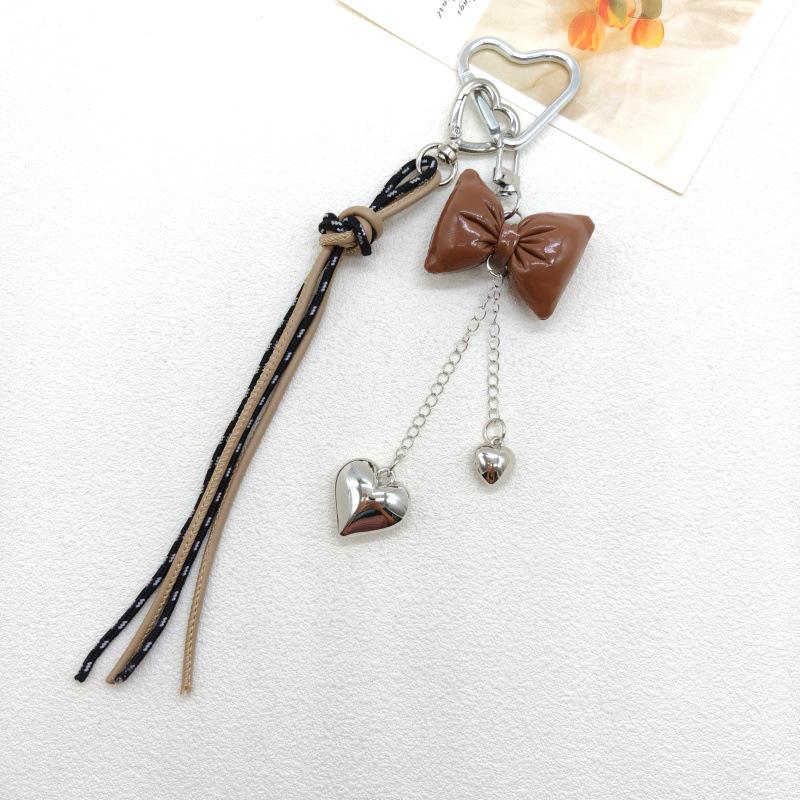 New Leather Heart Pendant Bag Keychain with Braided Rope and Bow Design