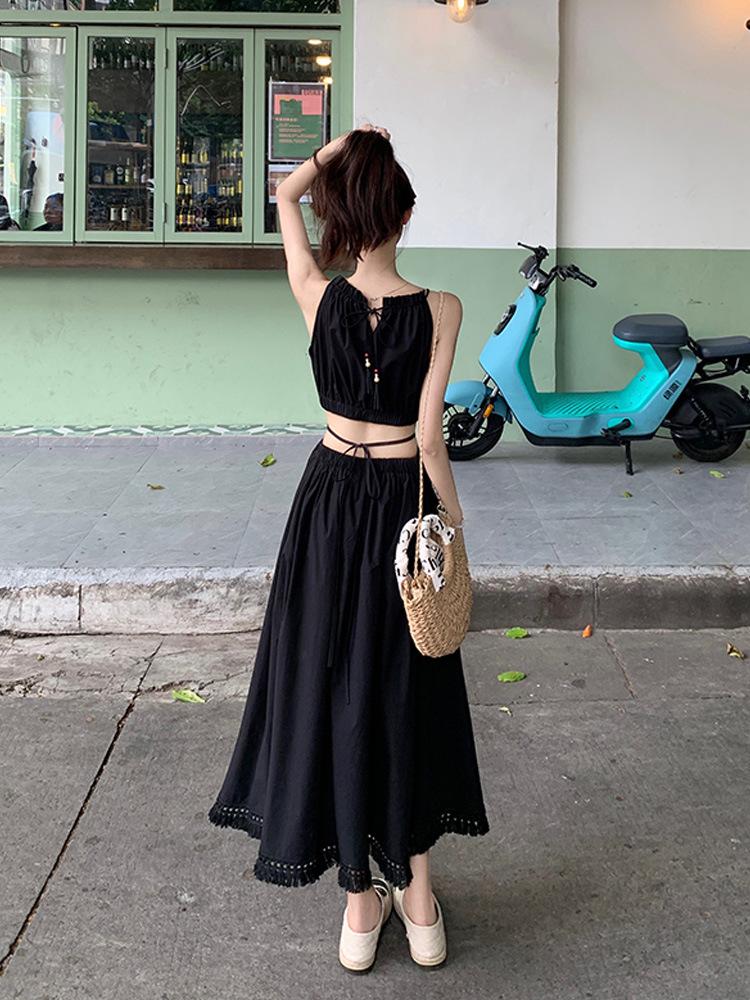 French hollow waist hanging neck suspender dress women's summer lace-up waist thin holiday style seaside fringed long dress