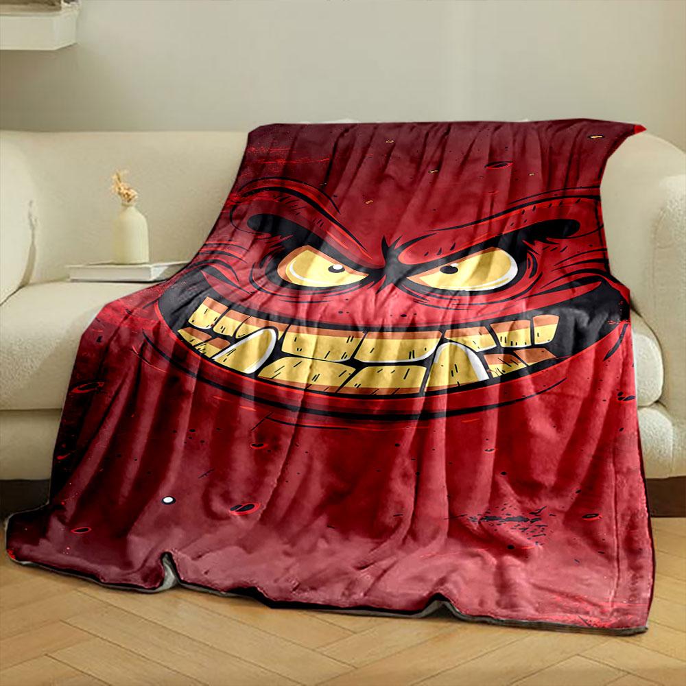 A menacing red face with sharp teeth, angry eyes, and bold expressions. for all seasons blanket lunch break throw gift