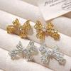 Copper Plated Hollow Bow Gold and Silver Zircon Stud Earrings - Retro Palace Style with Silver Needle Ornaments.
