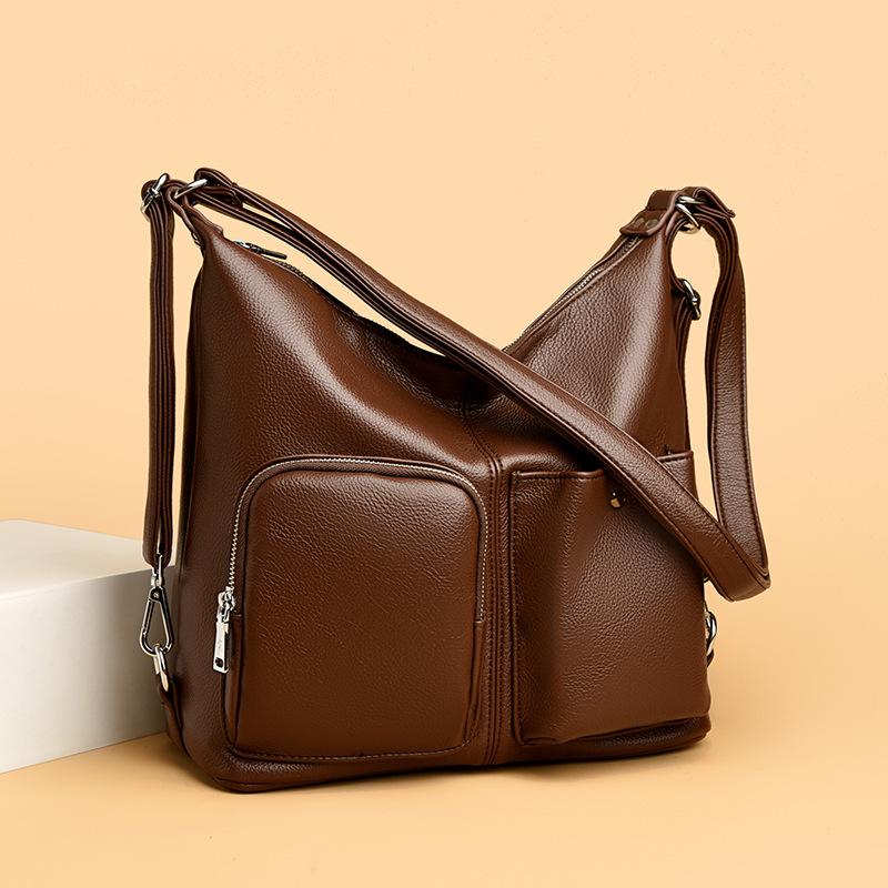 Die Retro-Umhängetasche aus weichem Leder ist eine modische Pendler-Einzelschultertasche, die schlicht und leicht ist.